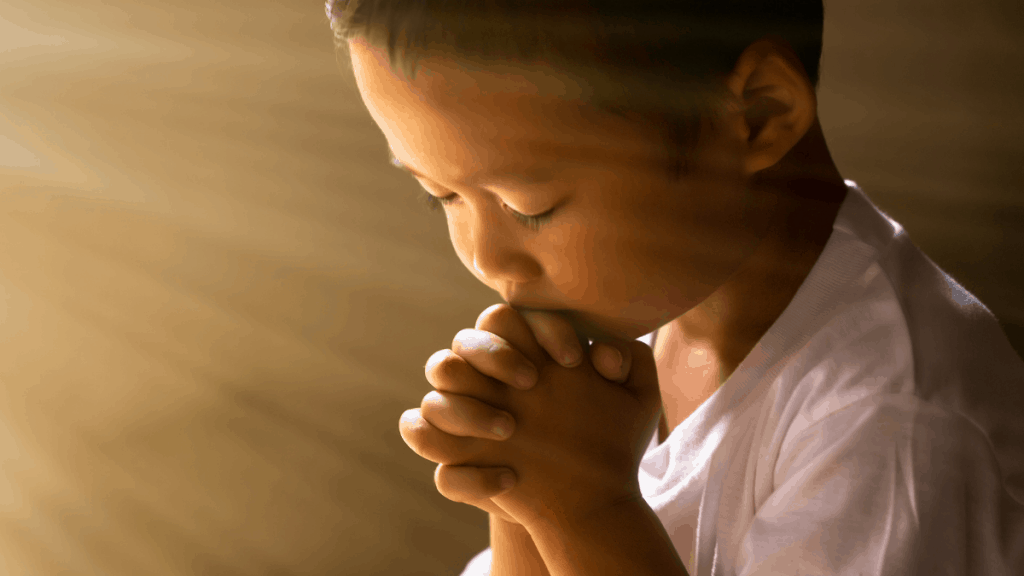 A boy praying for his nation.